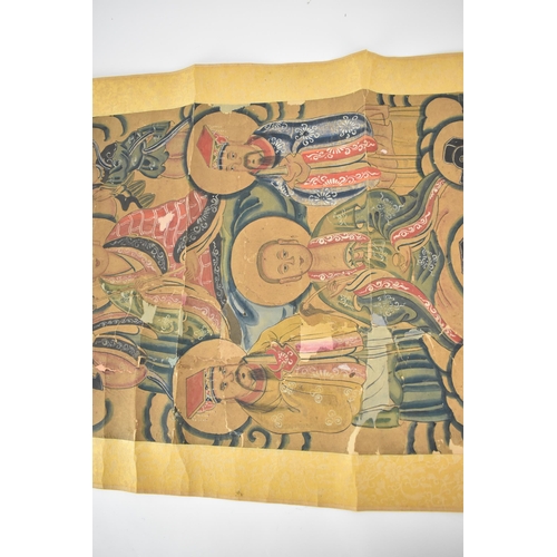 129 - A Chinese Qing Dynasty ancestral portraits, 18th/19th century, mounted as a scroll of men and women,... 