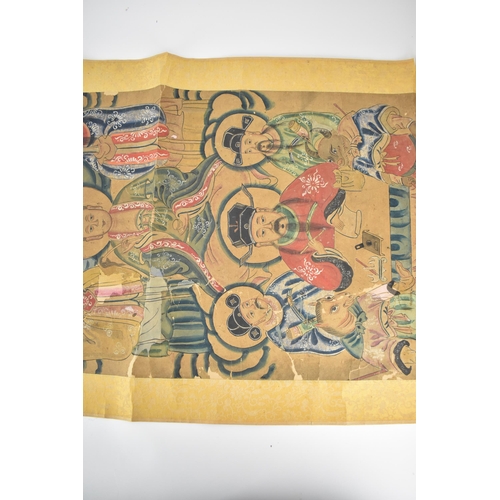 129 - A Chinese Qing Dynasty ancestral portraits, 18th/19th century, mounted as a scroll of men and women,... 