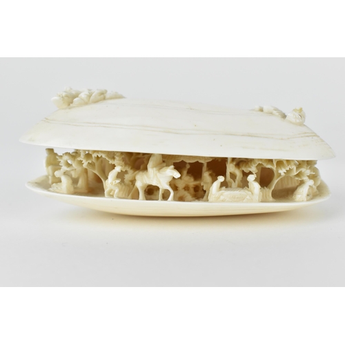 130 - Early 20th century ivory Okimonos comprising of a Japanese clam shell with figures, buildings and tr... 