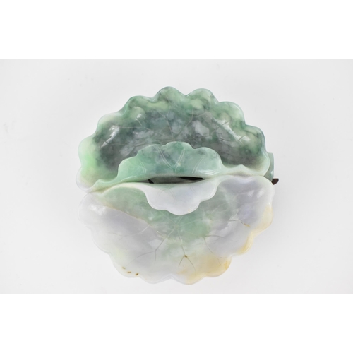 133 - A 20th century Chinese jadeite twin compartment bowl in the form of a water lily with flowers to the... 