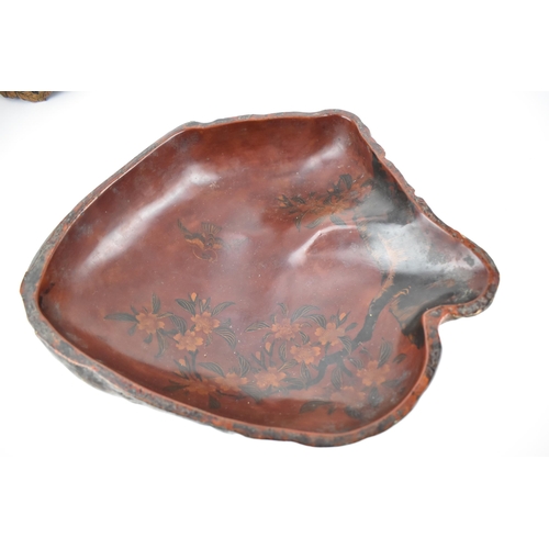 138 - A Japanese Meiji period red and brown lacquered irregular shaped bowl fashioned as a gnarled piece o... 