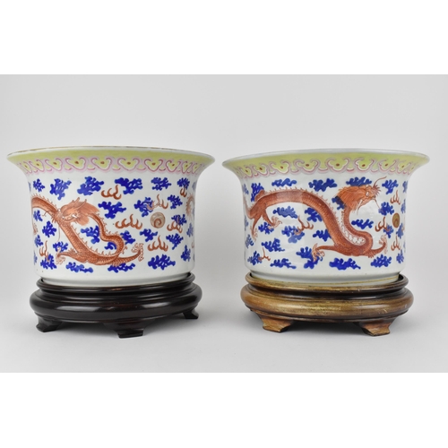 140 - A near pair of Chinese 20th century cylinder jardinières with flared rims and straight sides, decora... 