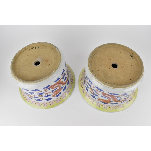 140 - A near pair of Chinese 20th century cylinder jardinières with flared rims and straight sides, decora... 