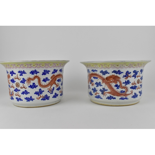 140 - A near pair of Chinese 20th century cylinder jardinières with flared rims and straight sides, decora... 