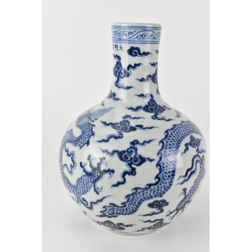 143 - A Chinese 20th century blue and white tianqiuping vase decorated with a dragon and clouds, 28cm h
Co... 