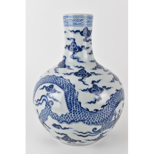 143 - A Chinese 20th century blue and white tianqiuping vase decorated with a dragon and clouds, 28cm h
Co... 