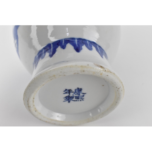 144 - A Chinese 20th century blue and white Gu vase with a lapet leaf band, and an interior scene with an ... 