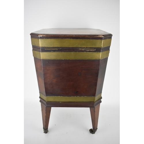 171 - A George III mahogany square cellaret with brass banding, a hinged lid and canted corners, enclosing... 