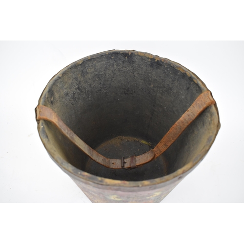 172 - A 19th century painted papermache fire bucket with an armorial device, a leather carrying handle and... 