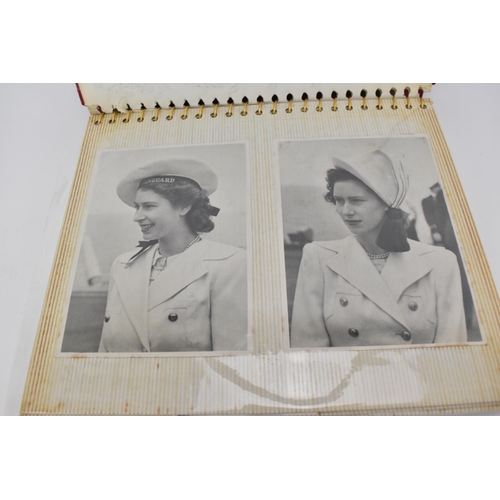 206 - A photo album containing 1940s photographs of King George VI, Queen Elizabeth, Princess Elizabeth an... 