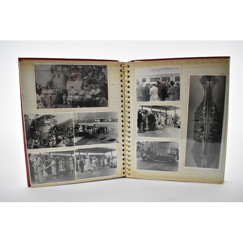 206 - A photo album containing 1940s photographs of King George VI, Queen Elizabeth, Princess Elizabeth an... 