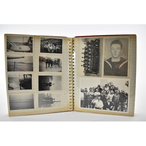 206 - A photo album containing 1940s photographs of King George VI, Queen Elizabeth, Princess Elizabeth an... 