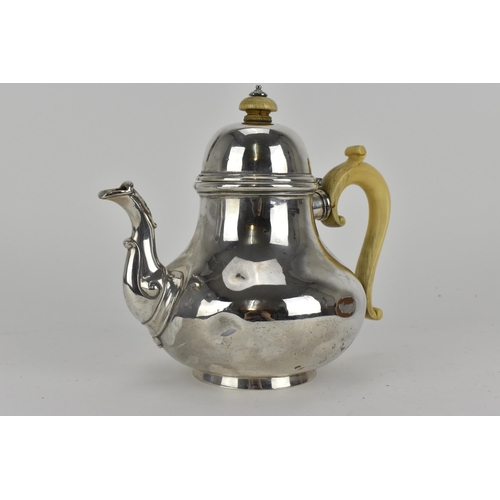 210 - A Victorian London silver teapot by Robert Garrard, dated 1857, with ivory handle and finial, 731g 
... 