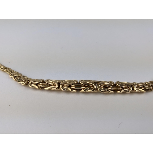 213 - A 9ct gold fancy link necklace stamped 375, 8.7g