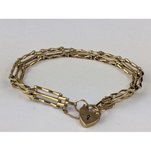 224 - A 9ct gold gate link bracelet with heart-shaped lock clasp, 8g