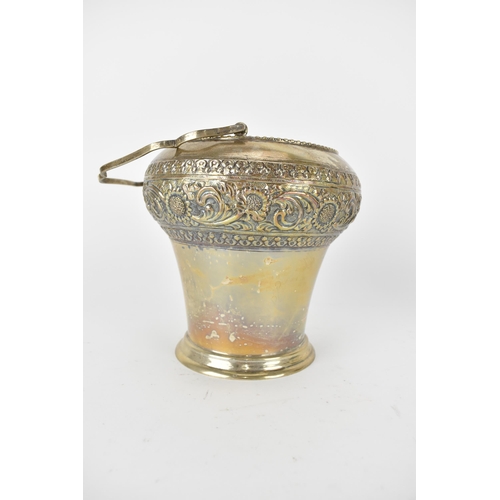 228 - An Indian silver ice bucket with a swing handle, a bulbous upper section and tapered sides, embossed... 