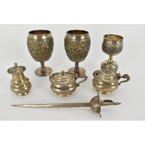 229 - Indian silver - comprising three piece condiment set, stamped sterling silver, two small goblets emb... 