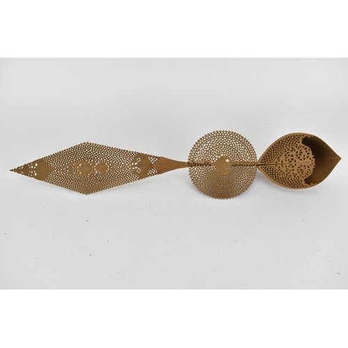 233 - A cased set of four late 19th century Trinidad finely carved and pierced wooden ornamental spoons, w... 