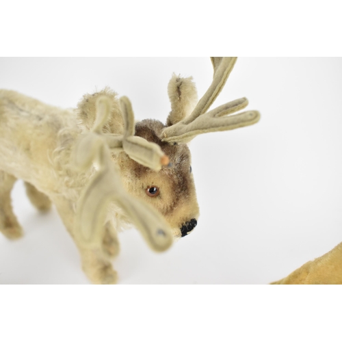 236 - A Steiff seal with a label 17cm high, a reindeer 24cm high to top of antler, a tiger 28cm l
Conditio... 