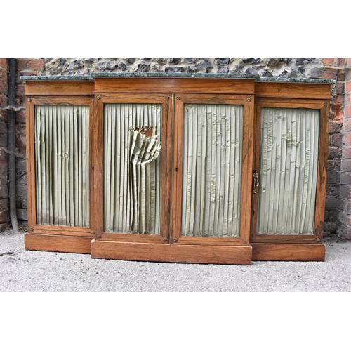 241 - A Regency brass string inlaid rosewood breakfront cabinet, with a mottled green marble top, over fou... 