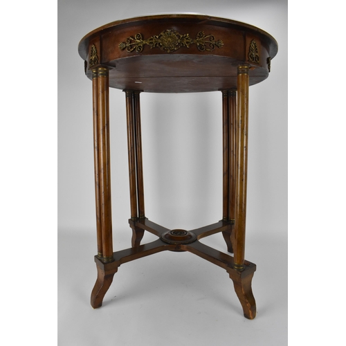 242 - An early 19th century French walnut table with gilt metal mounts and an inset mottled green marble t... 