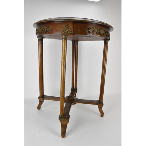 242 - An early 19th century French walnut table with gilt metal mounts and an inset mottled green marble t... 