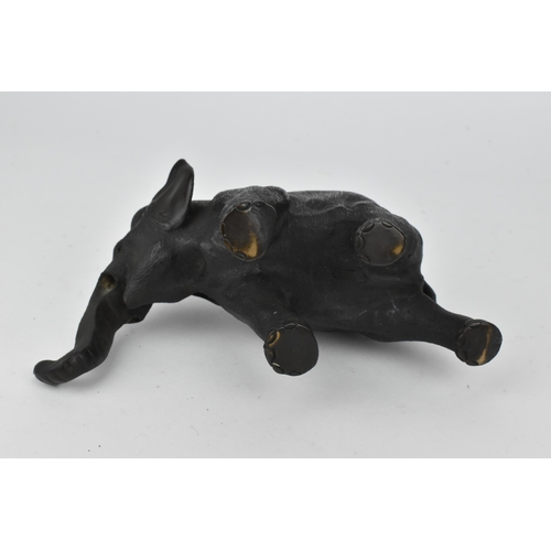 28 - A Japanese Meiji period patinated bronze model of an elephant, realistically rendered with textured ... 