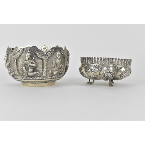 62 - Two early 20th century Indian silver bowls, the larger one decorated with panels of figures beneath ... 