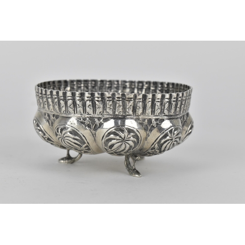 62 - Two early 20th century Indian silver bowls, the larger one decorated with panels of figures beneath ... 