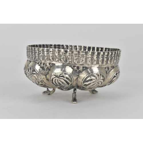 62 - Two early 20th century Indian silver bowls, the larger one decorated with panels of figures beneath ... 