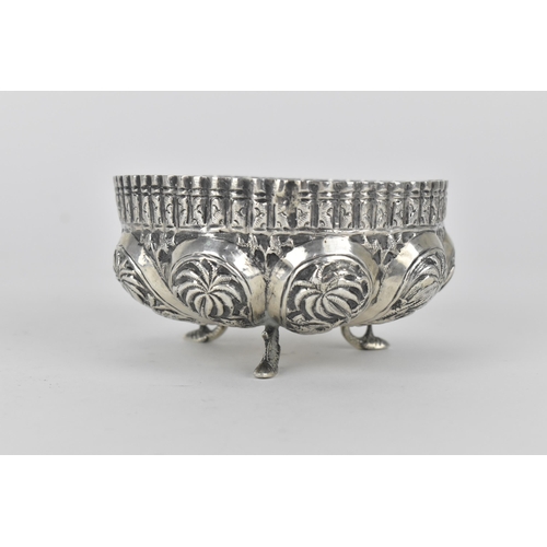 62 - Two early 20th century Indian silver bowls, the larger one decorated with panels of figures beneath ... 