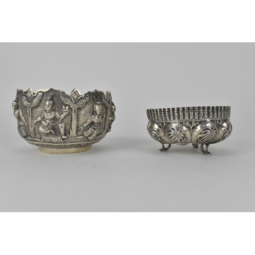 62 - Two early 20th century Indian silver bowls, the larger one decorated with panels of figures beneath ... 