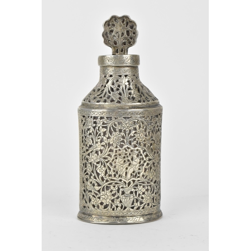 66 - An early 20th century Persian white metal clad glass bottle with a tapered neck, the covering pierce... 