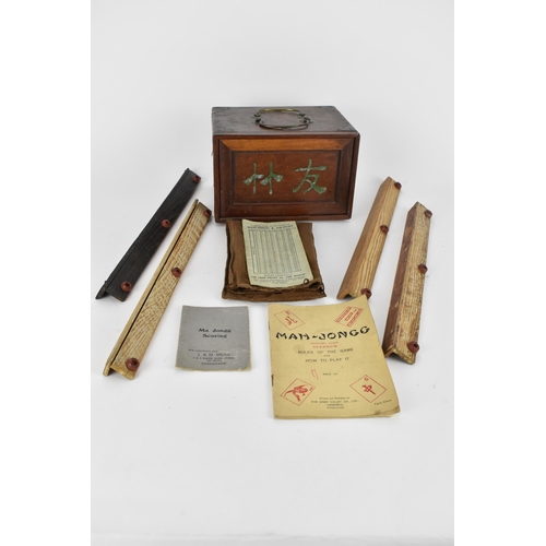 67 - An early 20th century Chinese bamboo and bone MahJong set comprising of one hundred and forty eight ... 