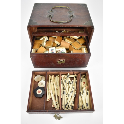 67 - An early 20th century Chinese bamboo and bone MahJong set comprising of one hundred and forty eight ... 