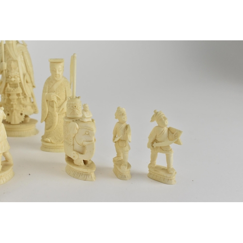 70 - A late 19th/early 20th century Chinese red stained and natural carved ivory chess set, modelled as E... 