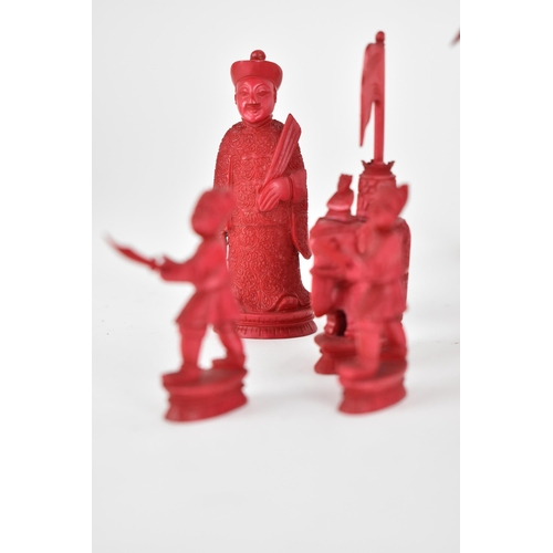 70 - A late 19th/early 20th century Chinese red stained and natural carved ivory chess set, modelled as E... 