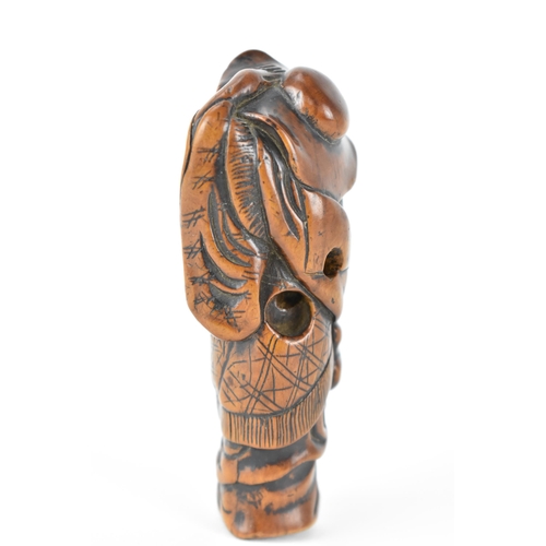 73 - A Japanese Edo period (18th/19th century) wooden netsuke of a scholar holding his hat on, 9.5cm h