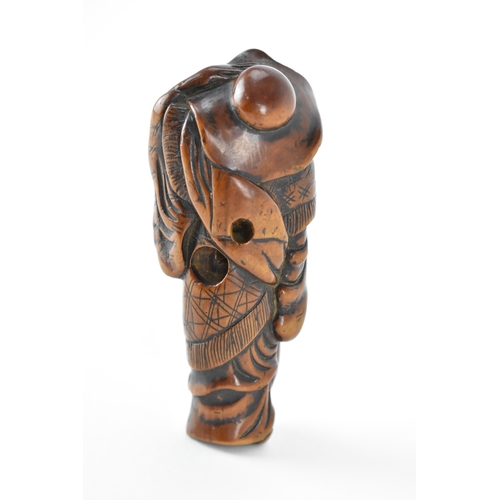 73 - A Japanese Edo period (18th/19th century) wooden netsuke of a scholar holding his hat on, 9.5cm h