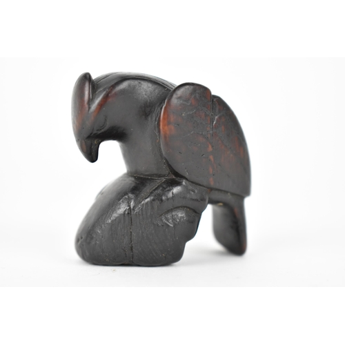 74 - A Japanese Edo period, 18th century wooden netsuke of a bird on a rock, 4cm h