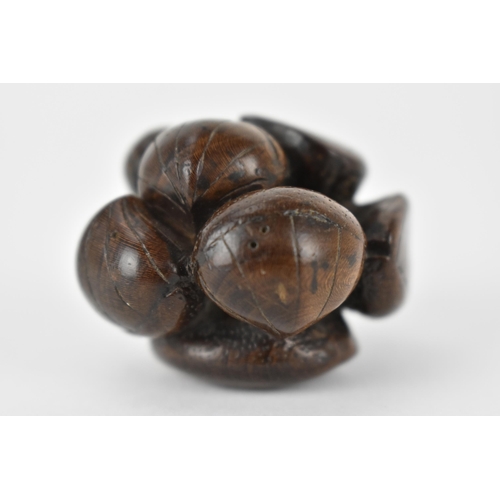 76 - A Japanese Edo period 18th/19th century wooden netsuke of a cluster of seashells