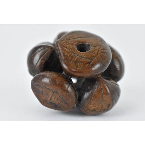 76 - A Japanese Edo period 18th/19th century wooden netsuke of a cluster of seashells