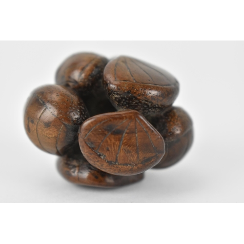 76 - A Japanese Edo period 18th/19th century wooden netsuke of a cluster of seashells