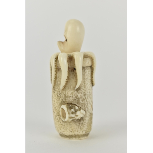 77 - A Japanese Meiji period, late 19th century ivory netsuke of an octopus in a basket with an articulat... 