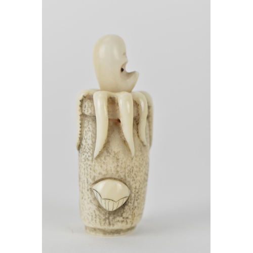 77 - A Japanese Meiji period, late 19th century ivory netsuke of an octopus in a basket with an articulat... 