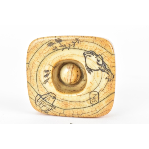 80 - A Japanese Edo period 18th/19th century, netsuke style ivory frog weight, with a metal ring, attache... 