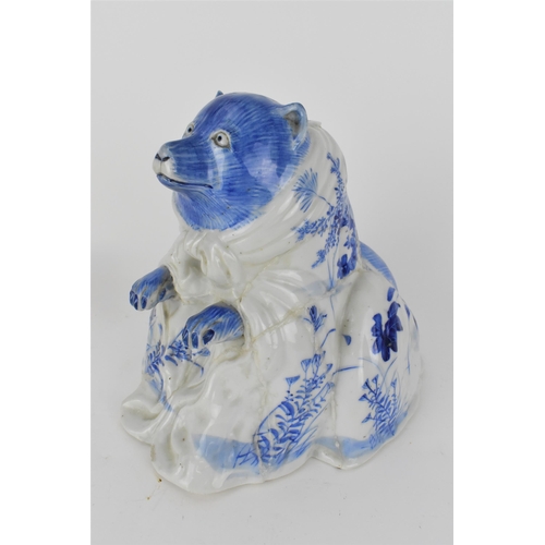 83 - An early 20th century Japanese blue and white incense burner in the form of a bear, decorated with f... 