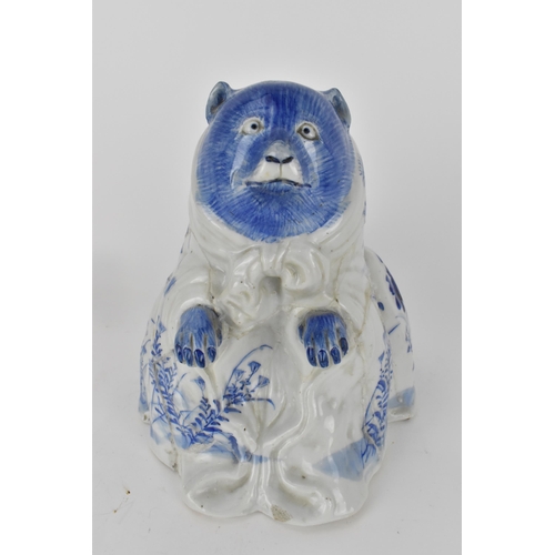 83 - An early 20th century Japanese blue and white incense burner in the form of a bear, decorated with f... 