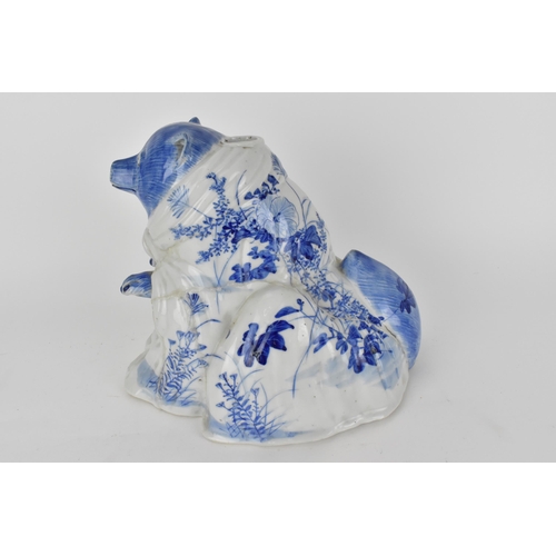 83 - An early 20th century Japanese blue and white incense burner in the form of a bear, decorated with f... 