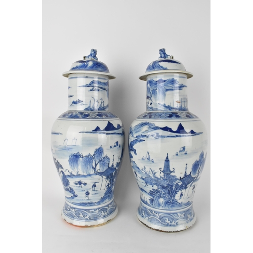 84 - A pair of Chinese Qing dynasty blue and white porcelain lidded vases, 19th century, of baluster shap... 